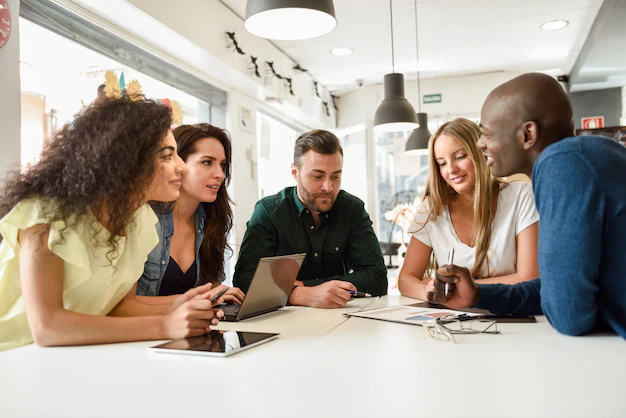 multi-ethnic-group-young-people-studying-together-white-de_1139-987